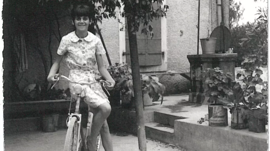 2 susnjevica 1960s gracijela bortul on a bike in front of her house